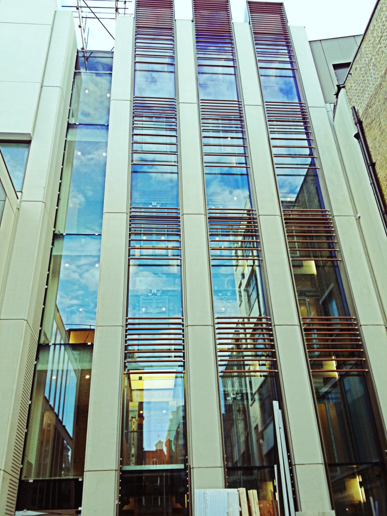 Glazed façade with vertical architectural feature system